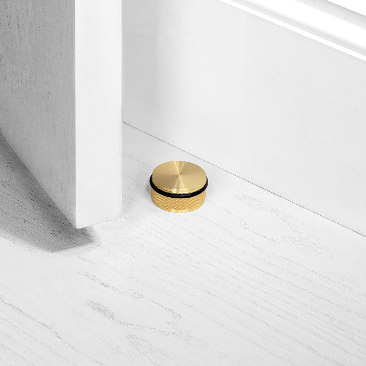 BUSTER + PUNCH® - DOOR STOP / FLOOR - BRASS